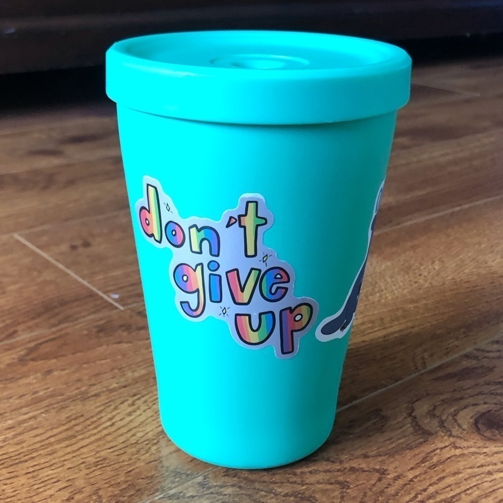 Teal steel cup with lid and stickers
